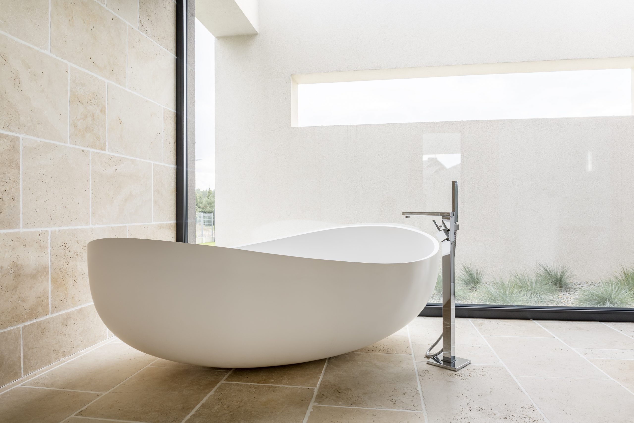 bathtub remodeling with a stylish oval shaped tub in an open space