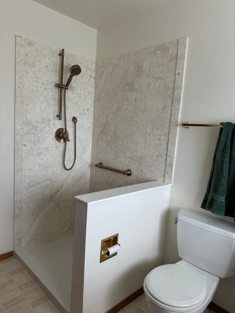 accessible bathroom with walk-in shower and grab bars