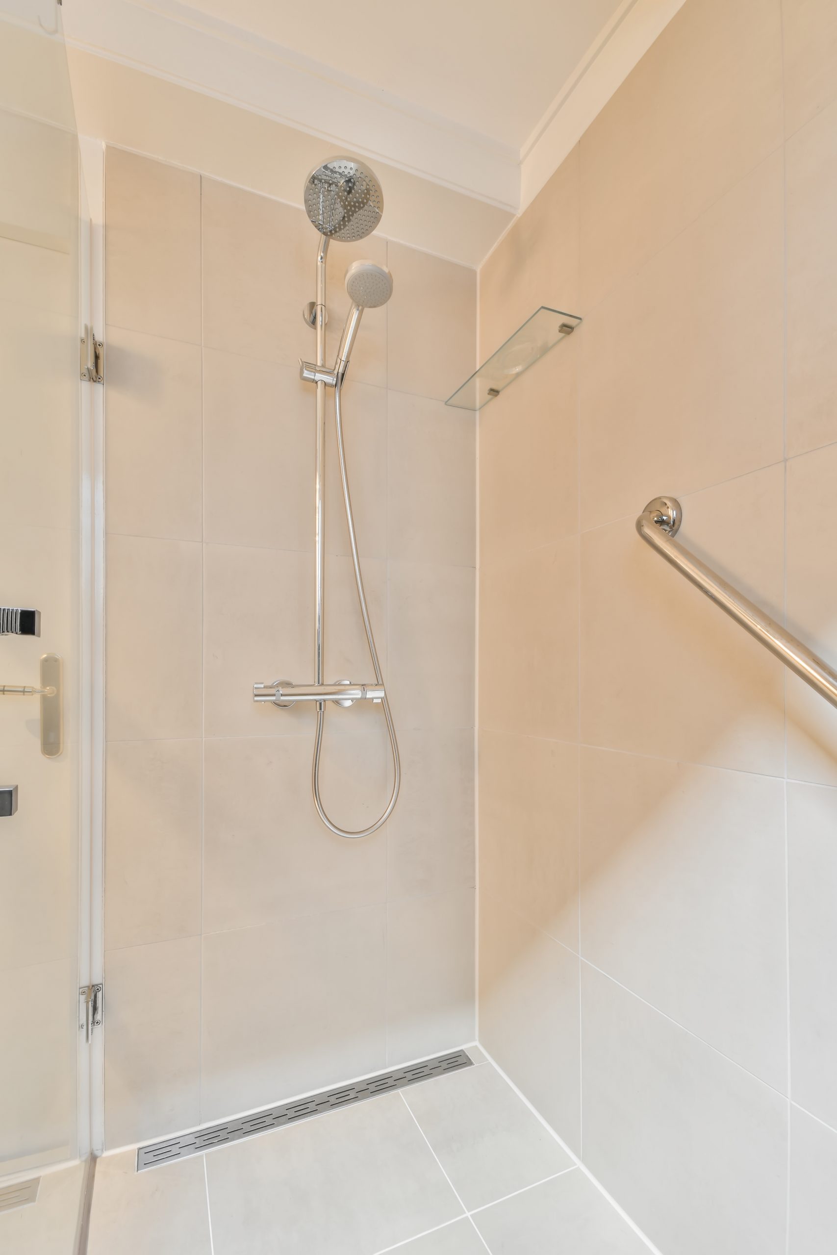 roll-in shower, wheel chair accessible with grab bar
